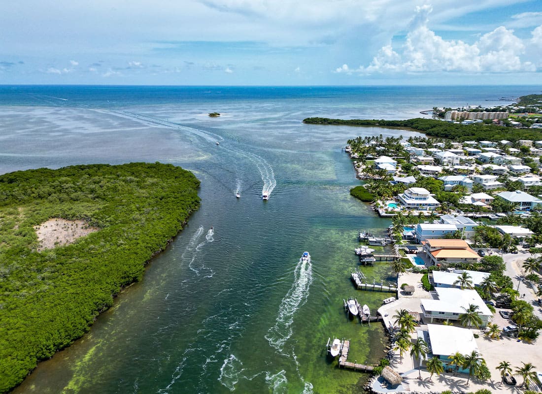 Tavernier, FL - Aerial View of Homes and Large Boat Channel Cut Through Tavernier Key Island in the Florida Keys